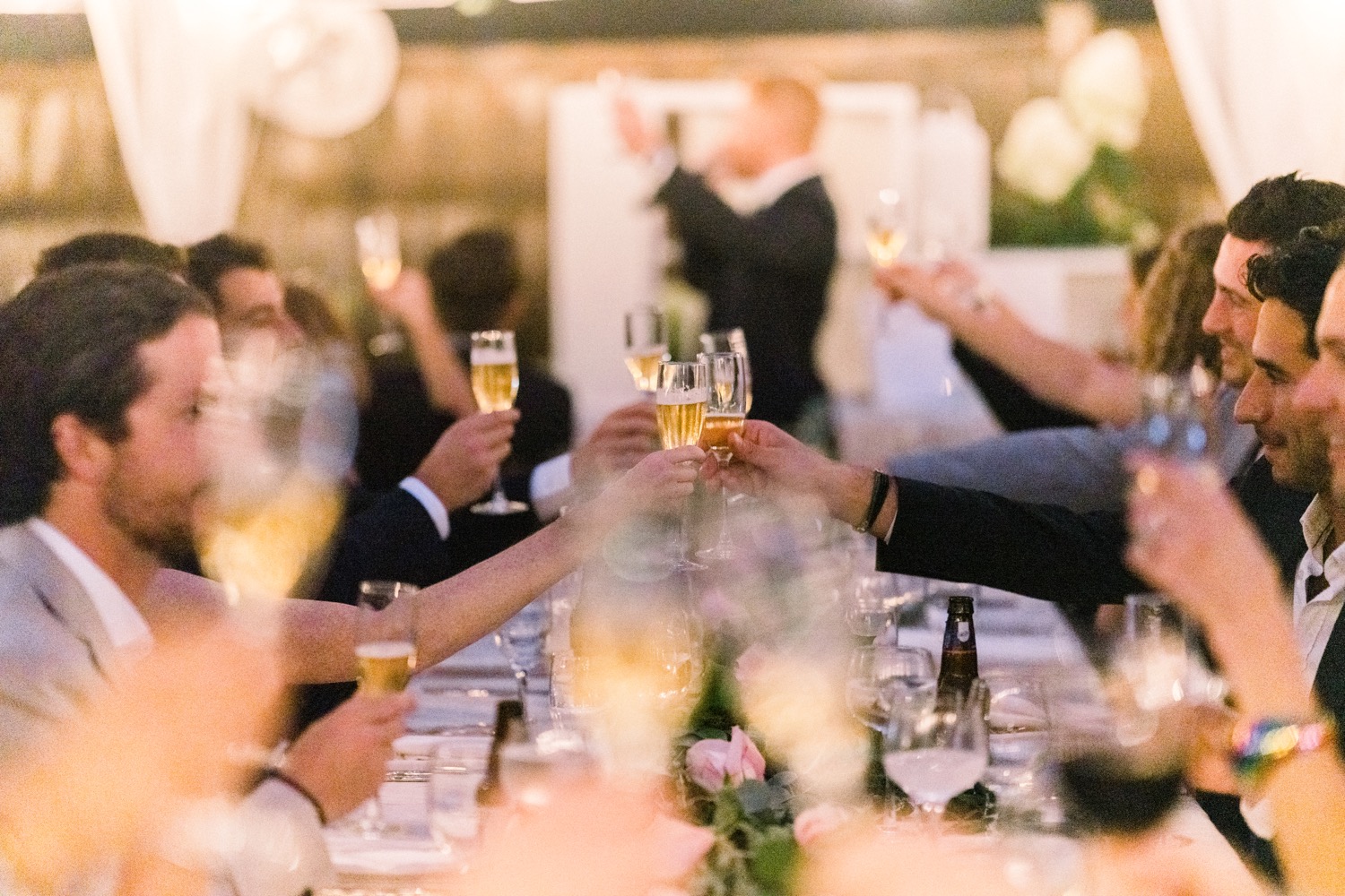 Eco friendly Wedding: How to Plan a Sustainable Wedding: Close-up shot of wedding guests toasting at the reception table