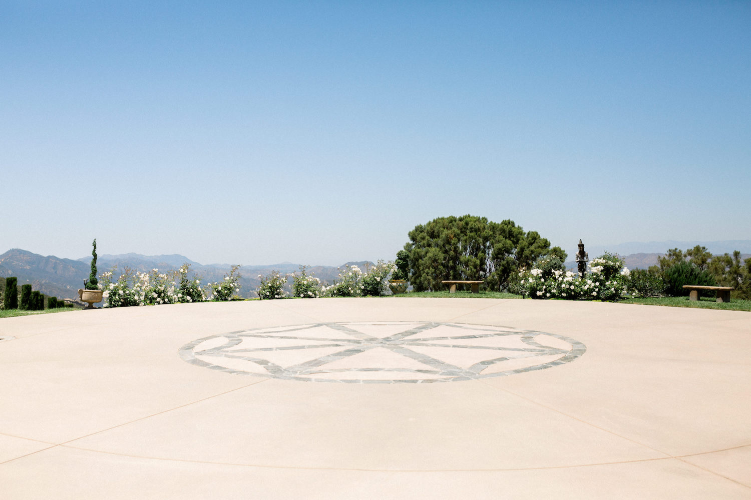 Stone Mountain Estates Luxury Wedding Venue Guide: The helicopter pad surrounded by luscious landscaping and mountains 