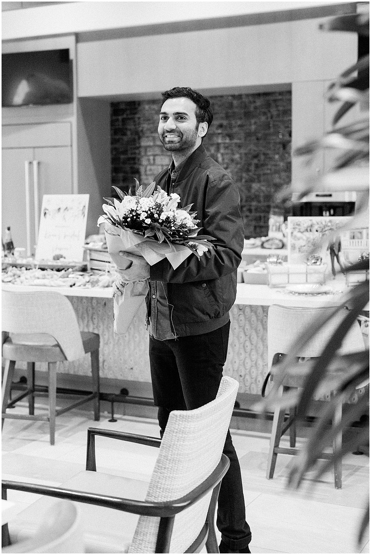 Indian Groom presents flowers to his bride at engagement party