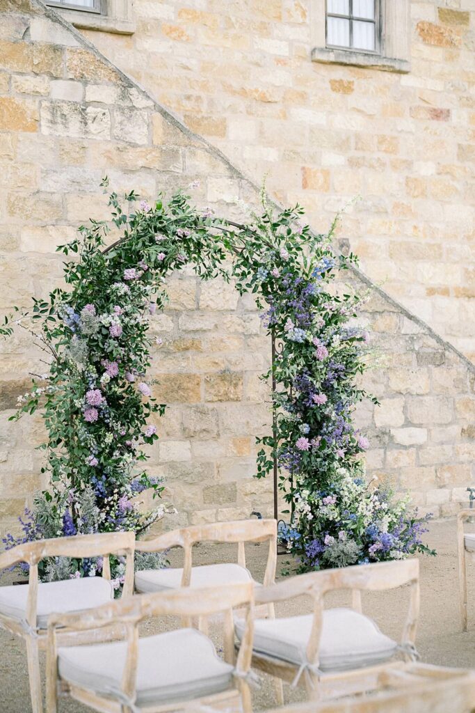 Whimsical Floral Arch at Tuscan inspired Ceremony
